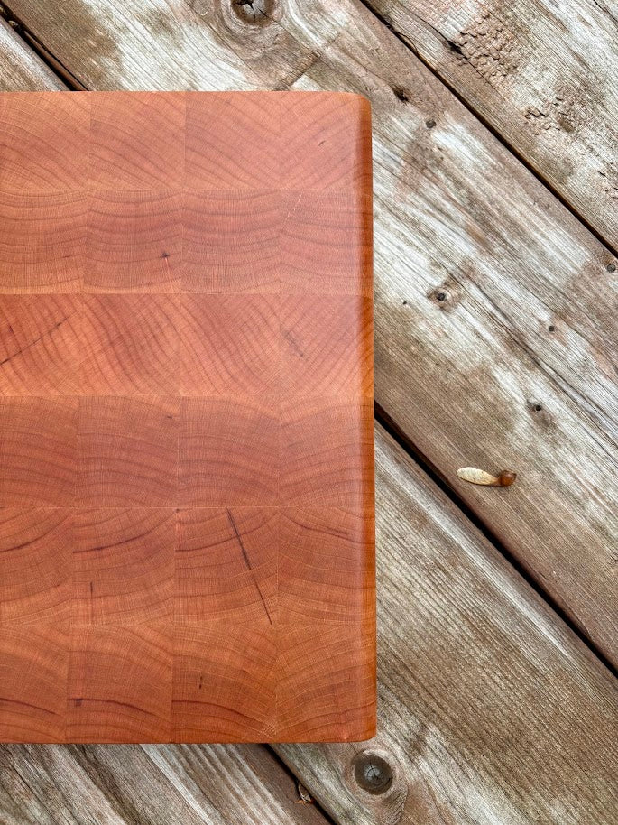Cherry end grain cutting board 12.75 x 10.5 in, top view of the end grain