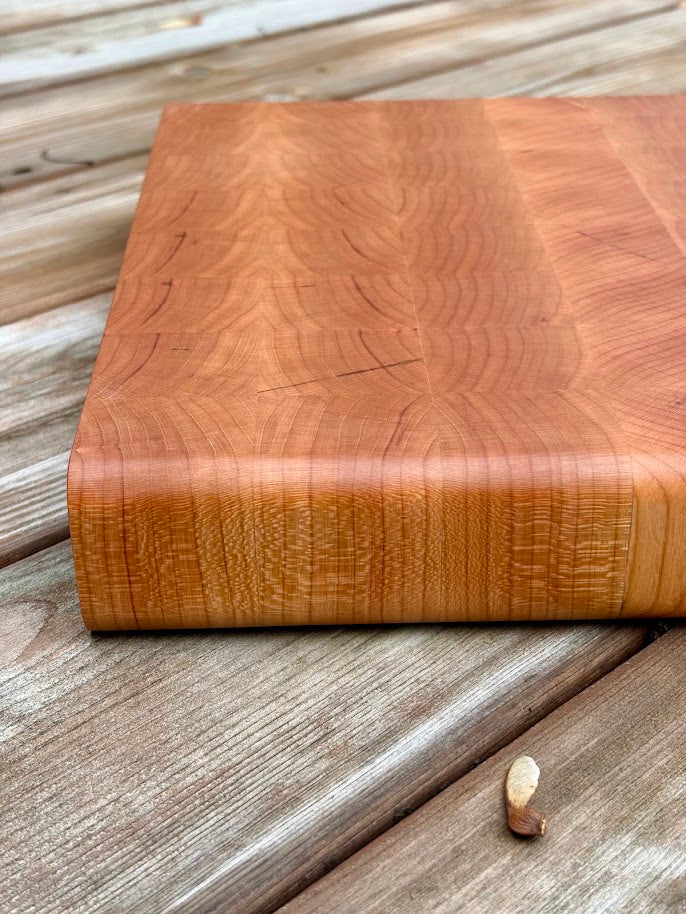 Close-up of the edge of the cherry end grain cutting board 12.75 x 10.5 in